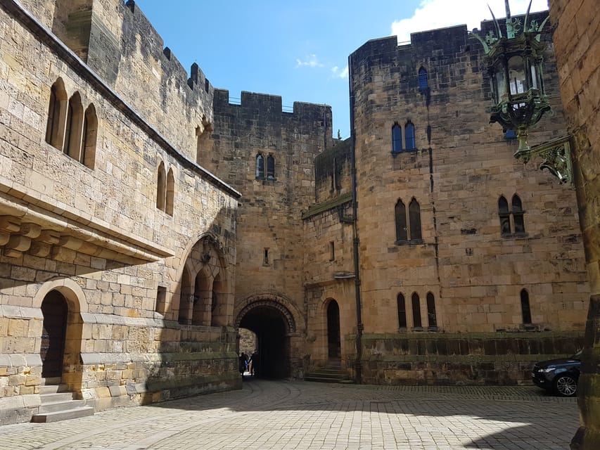 From Edinburgh: Holy Island, Alnwick Castle & Northumbria - The drive through Northumbria: Bamburgh, sheep views, and guide jokes