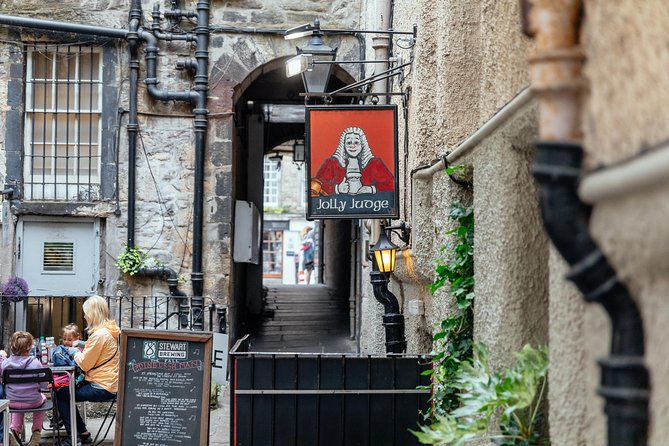 Highlights & Hidden Gems With Locals: Best of Edinburgh Private Tour - Grassmarket: Pub Streets on the Site of Public Executions
